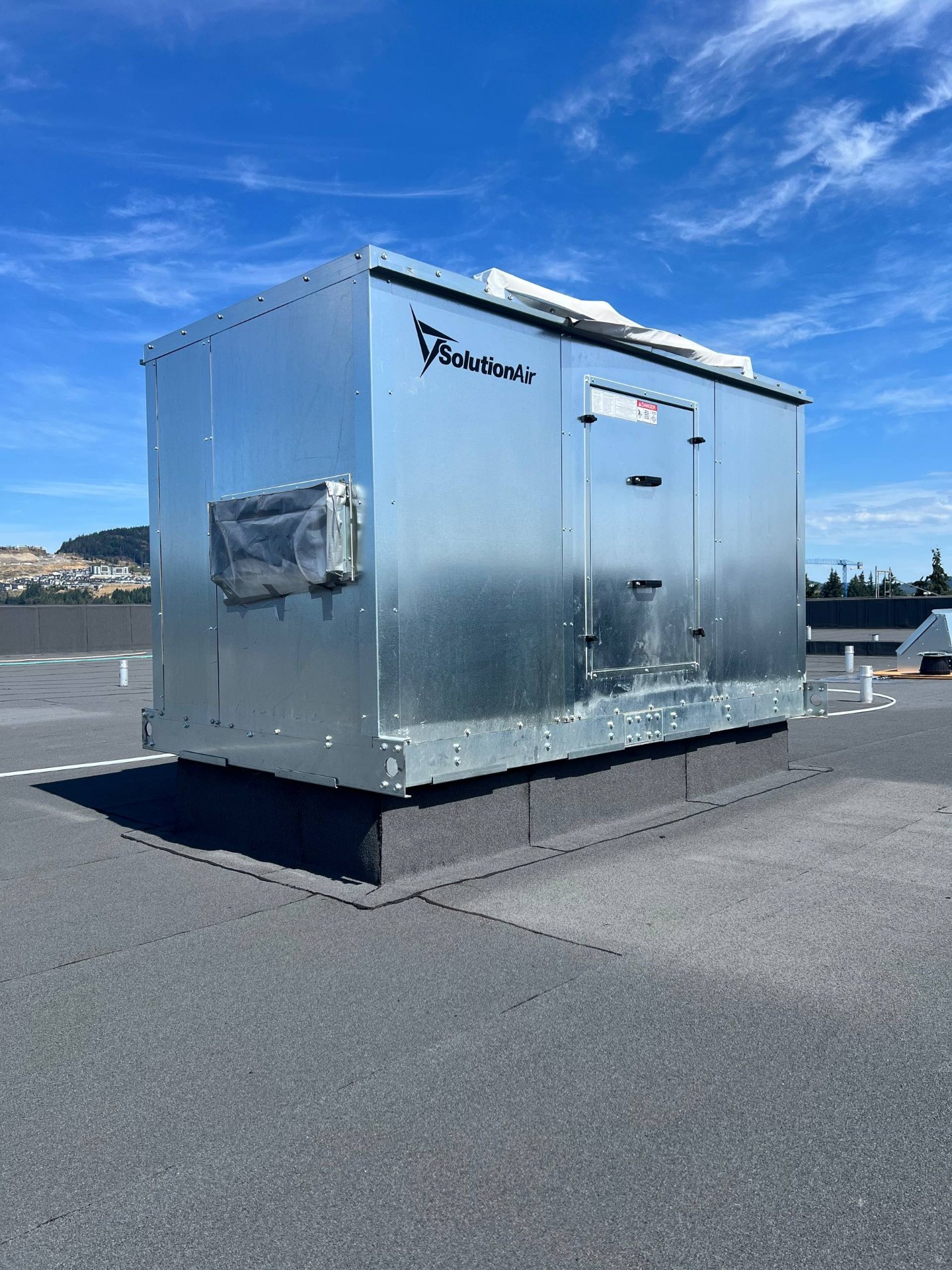 Rooftop air handling unit set on a flashed curb